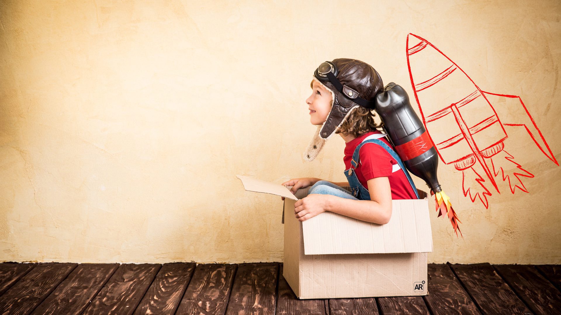 Child with aviator goggles and jetpack - AR imagination